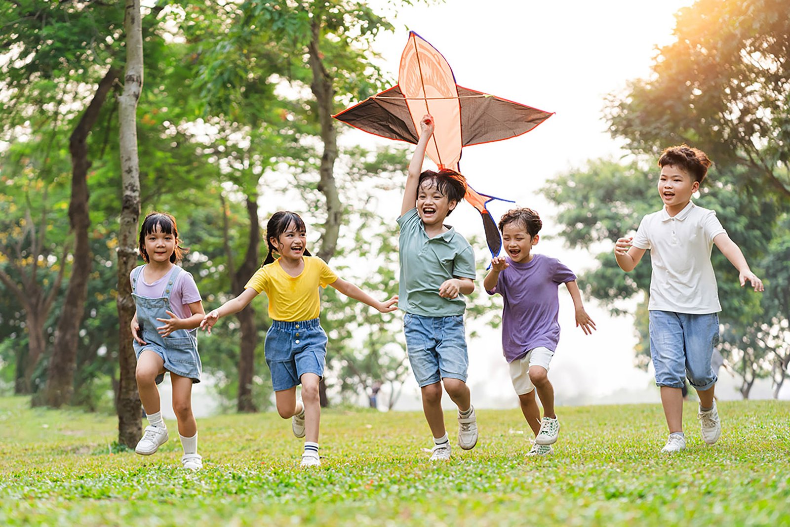 Group of cute Asian children playing in a park